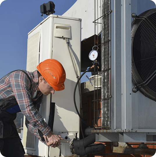 man fixing hvac system